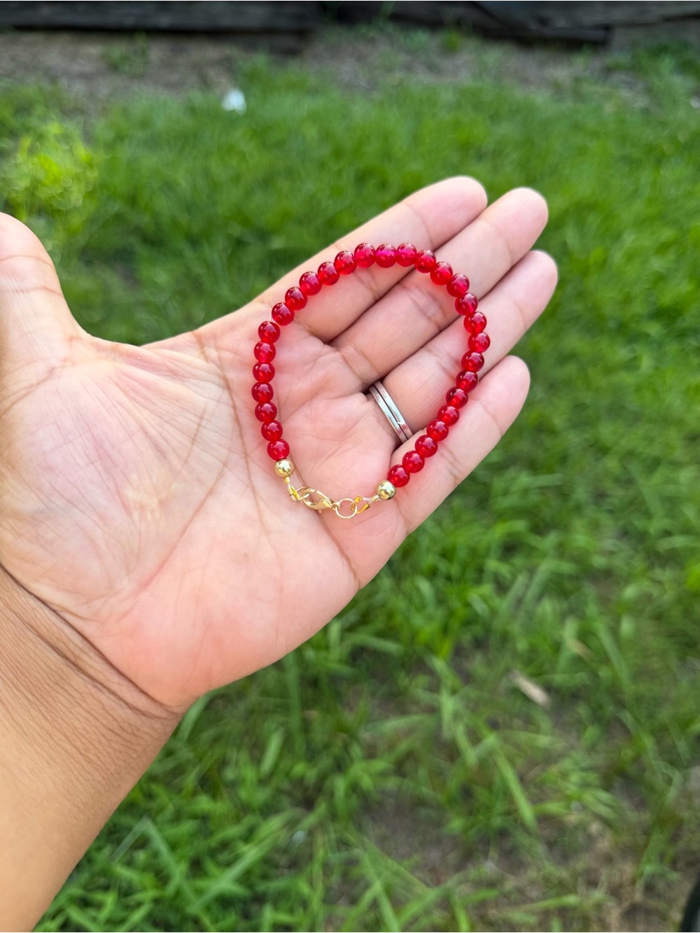 Hand Crafted Red Beaded Bracelet with Gold Accents